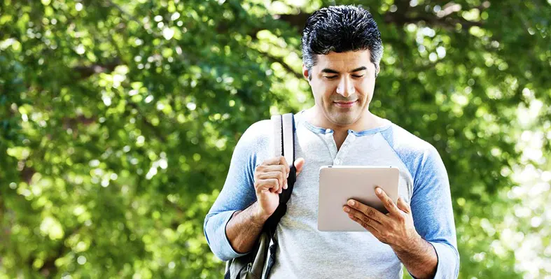 Man holding tab in his hand 