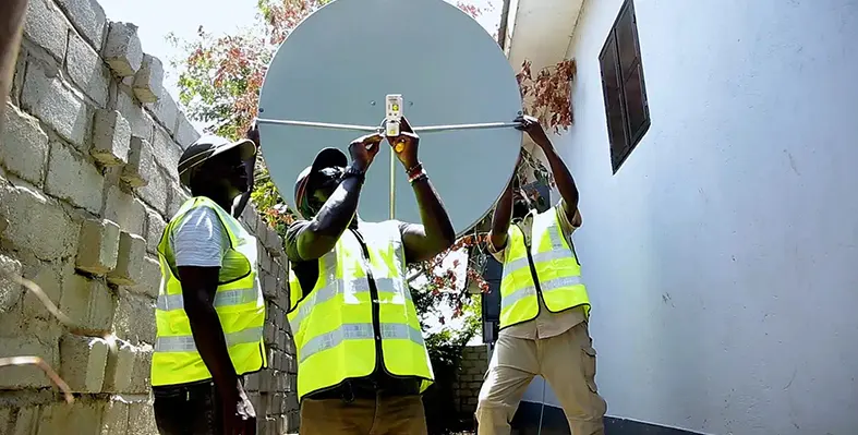 Two_men_setting_up_satellites
