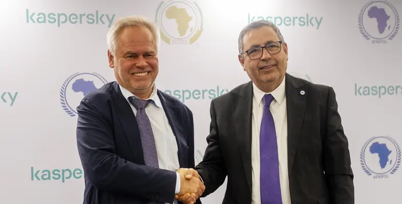 Eugene Kaspersky and  Jalel Chelba shaking hands 