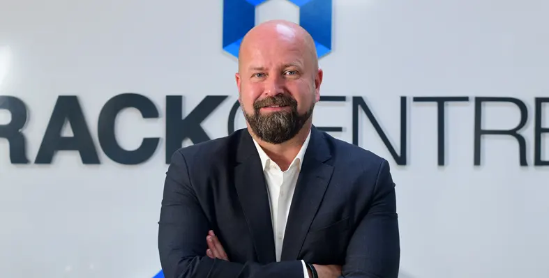 Image of Lars Johannisson with Rack Centre's logo in the background  