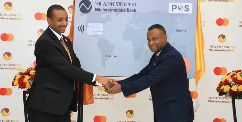 NIB & MasterCard delegates shake hands confirming partnership