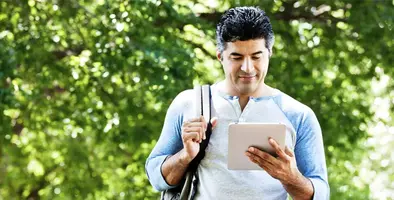 person with tab in hand 