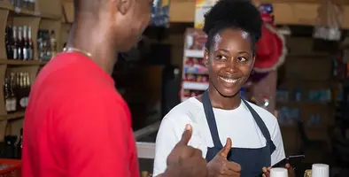 Two_Africa's_young_people_show_thumbs_up_while_mobile_money_transaction