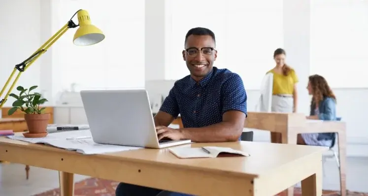 Young African man with laptop