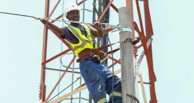 A man from the Paratus team installing fibre. 